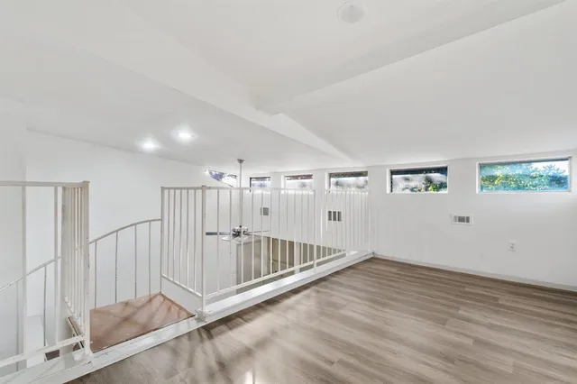 a view of entryway with wooden floor