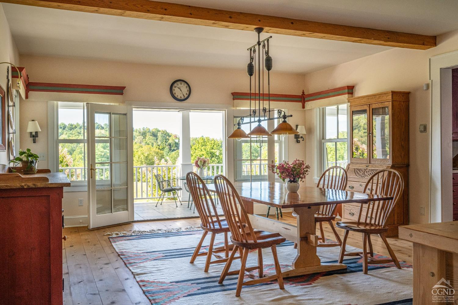 137 Catskill View Road Claverack, NY 12534 - Photo 11 of 55 a view of a dining room and livingroom with furniture wooden floor a chandelier