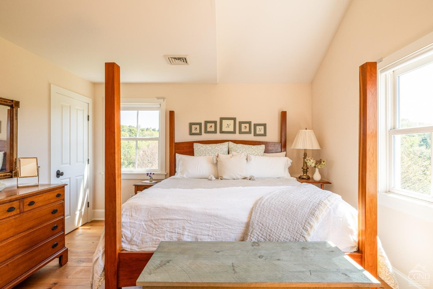 137 Catskill View Road Claverack, NY 12534 - Photo 29 of 55 a bedroom with a large bed and a flat tv screen on dresser
