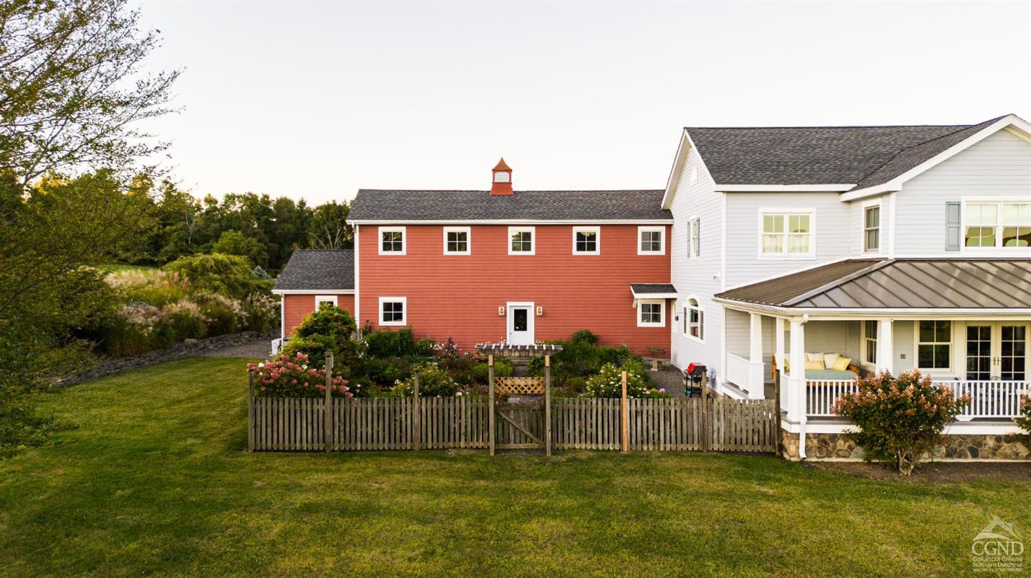 137 Catskill View Road Claverack, NY 12534 - Photo 8 of 55 a front view of a house with a yard table and chairs