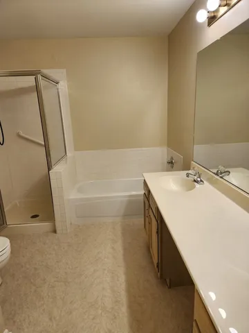 a bathroom with a sink a mirror and a bathtub