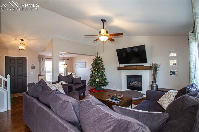 6789 Akron Road Colorado Springs, CO 80923 - Photo 6 of 28 Living room, dining room, & entry