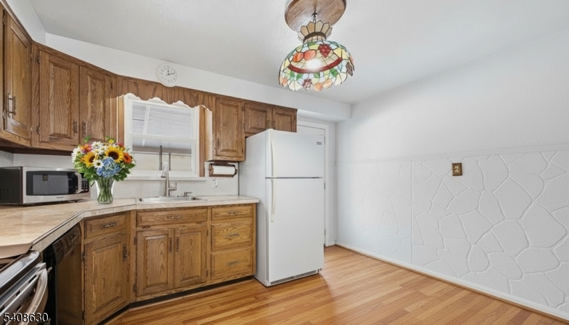 435 Spring Mills Road Milford, NJ 08848 - Photo 11 of 39 a kitchen with a sink a refrigerator and a stove