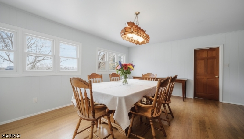 435 Spring Mills Road Milford, NJ 08848 - Photo 14 of 39 a view of a dining room with furniture and wooden floor
