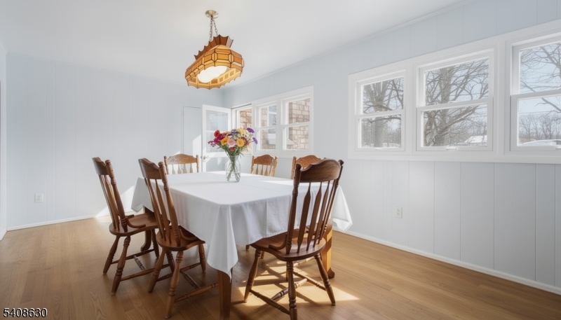 435 Spring Mills Road Milford, NJ 08848 - Photo 15 of 39 a dining room with furniture a rug and wooden floor