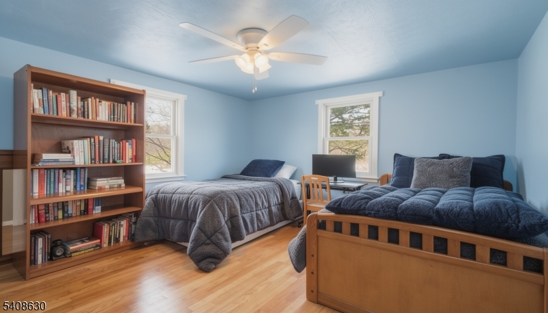 435 Spring Mills Road Milford, NJ 08848 - Photo 23 of 39 a bedroom with two beds and a book shelf