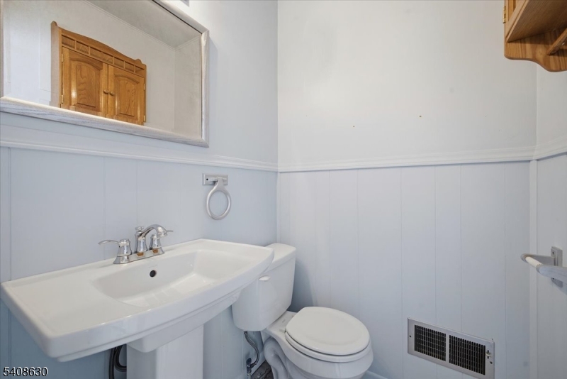 435 Spring Mills Road Milford, NJ 08848 - Photo 27 of 39 a bathroom with a sink a toilet and mirror