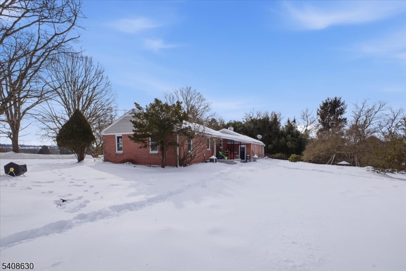 435 Spring Mills Road Milford, NJ 08848 - Photo 30 of 39 a big house with trees in the background