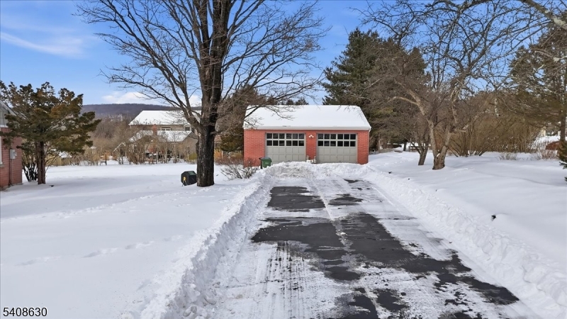 435 Spring Mills Road Milford, NJ 08848 - Photo 5 of 39 a street view covered with snow