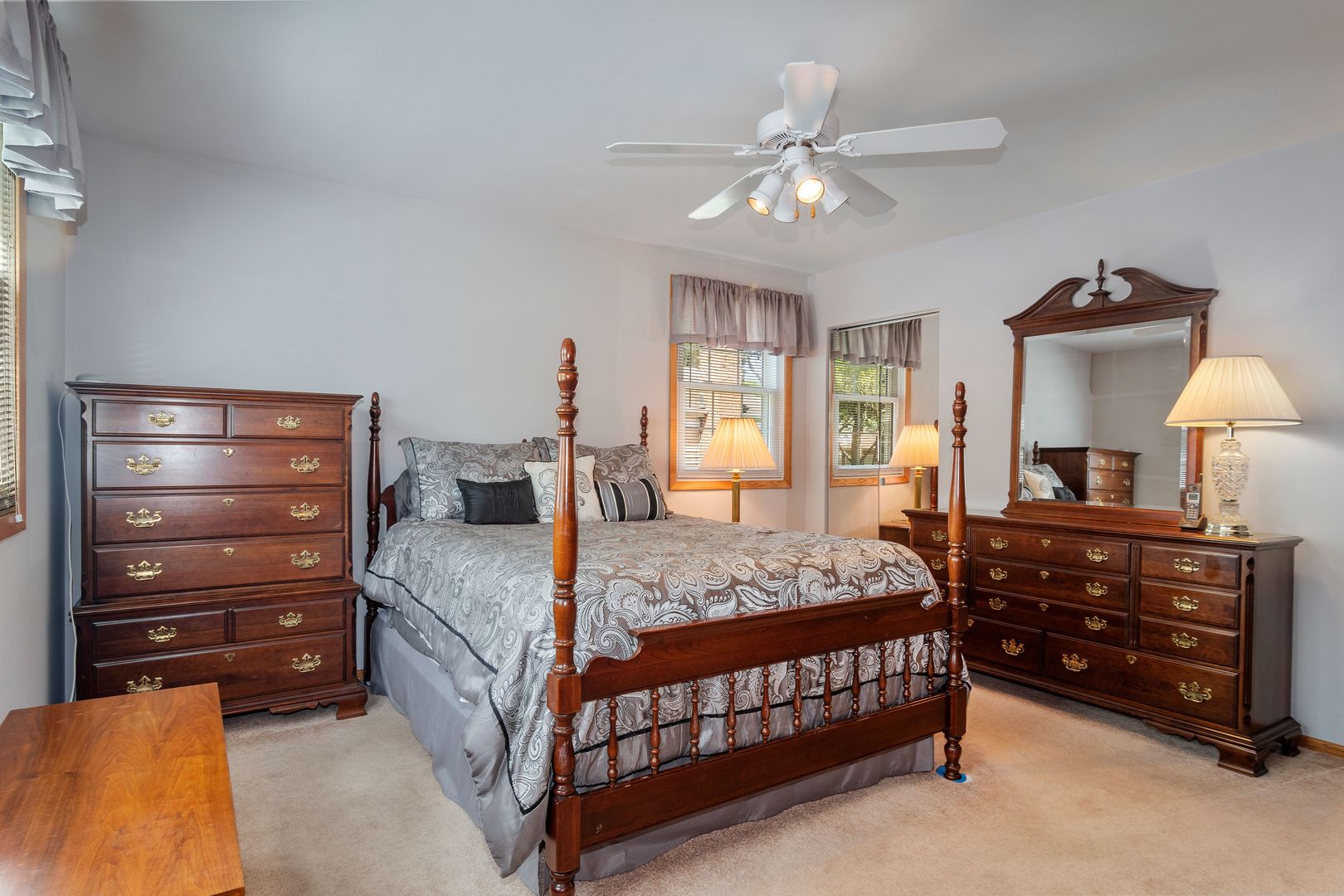 73 Foxcroft Road Naperville, IL 60565 - Photo 20 of 37 a bedroom with a bed a chandelier and dresser