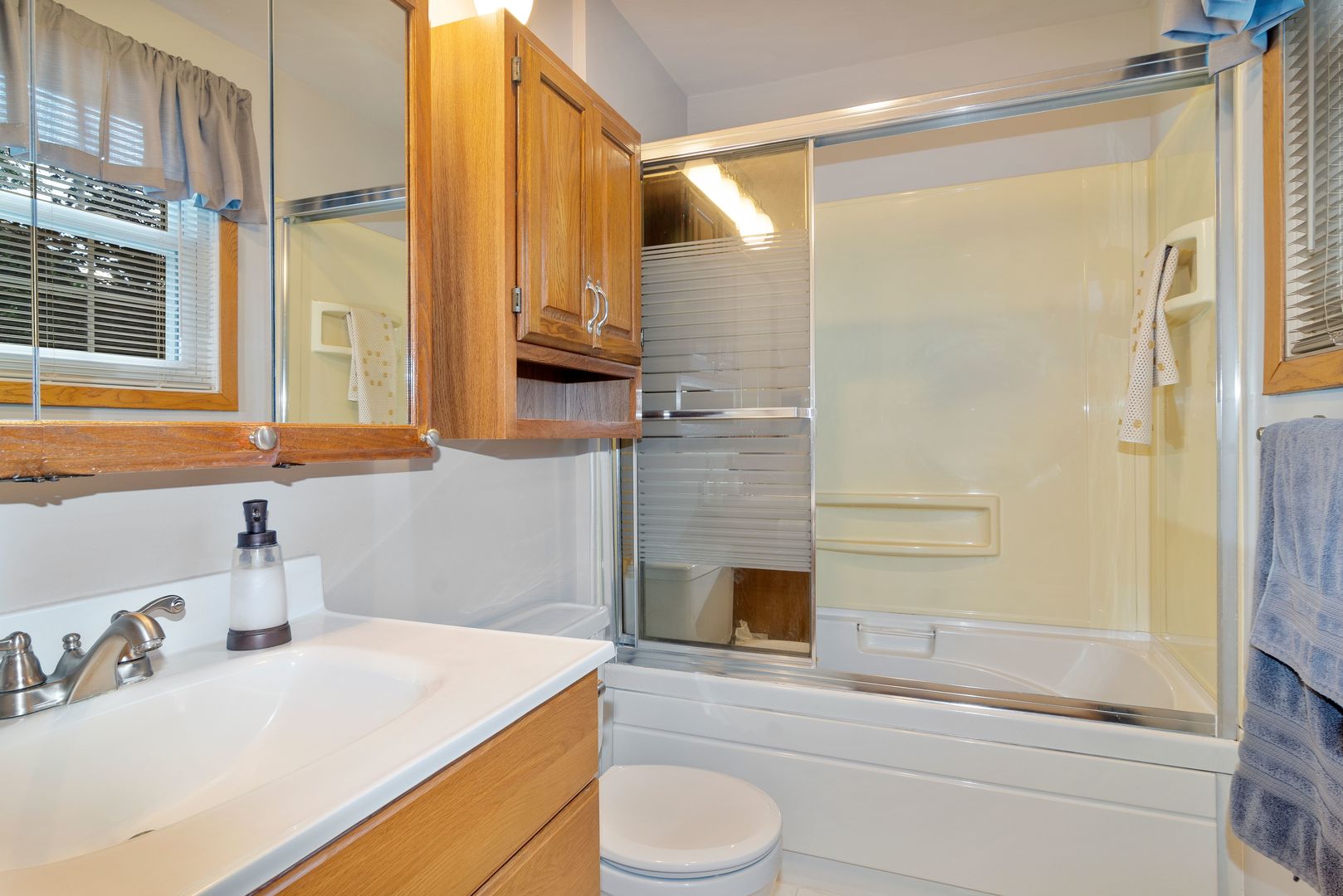 73 Foxcroft Road Naperville, IL 60565 - Photo 21 of 37 a bathroom with a sink toilet and shower