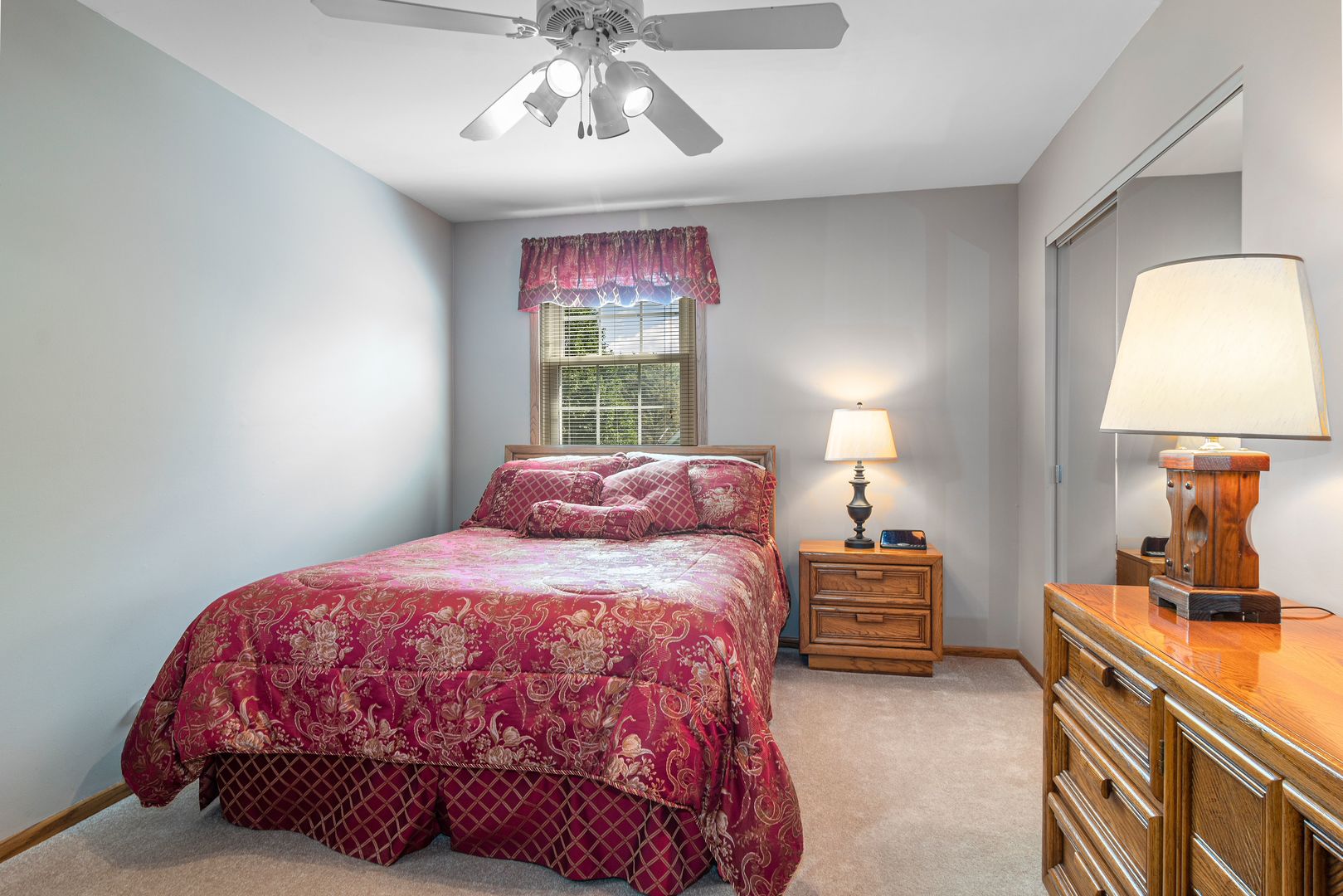 73 Foxcroft Road Naperville, IL 60565 - Photo 23 of 37 a bedroom with a bed and a lamp