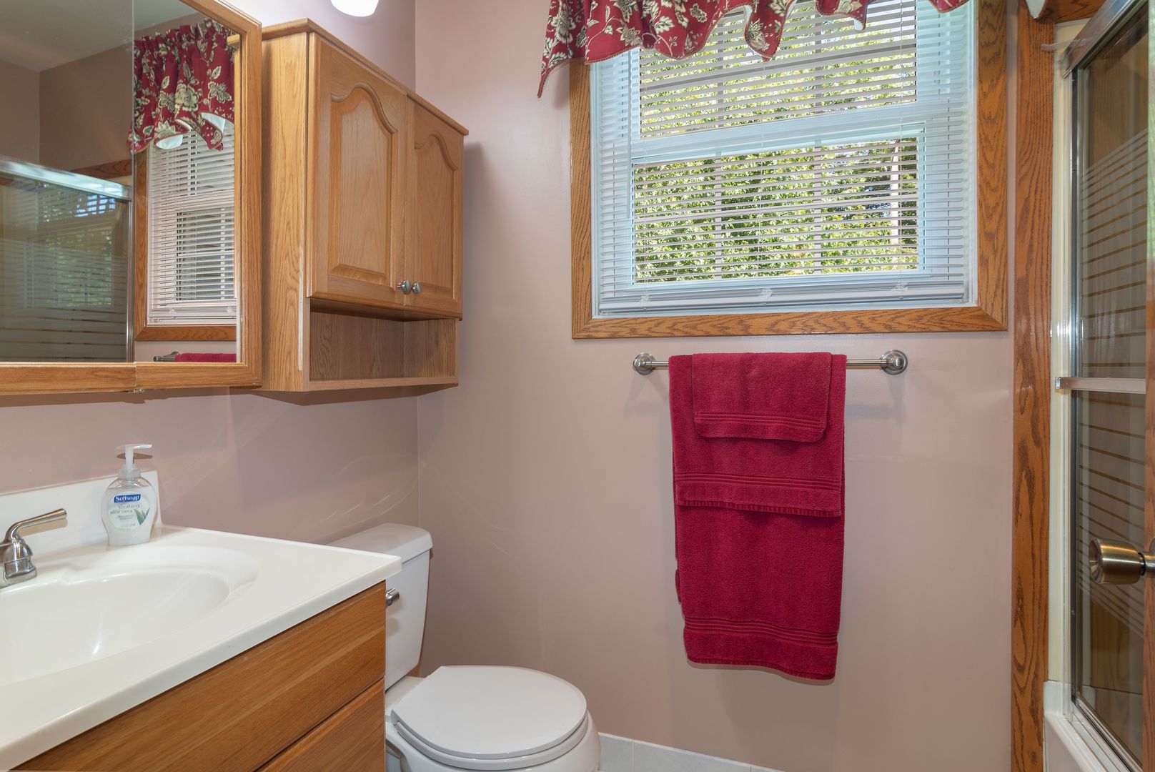 73 Foxcroft Road Naperville, IL 60565 - Photo 25 of 37 a bathroom with a sink toilet and window