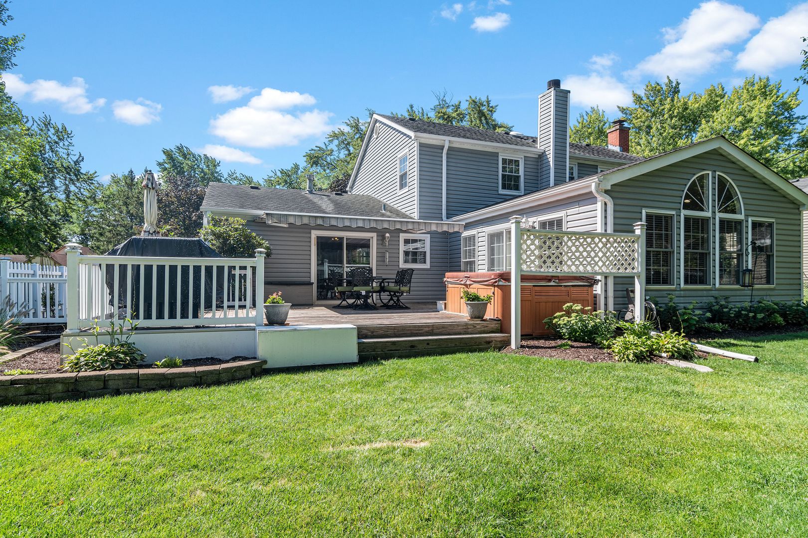 73 Foxcroft Road Naperville, IL 60565 - Photo 30 of 37 a view of a house with a yard and deck