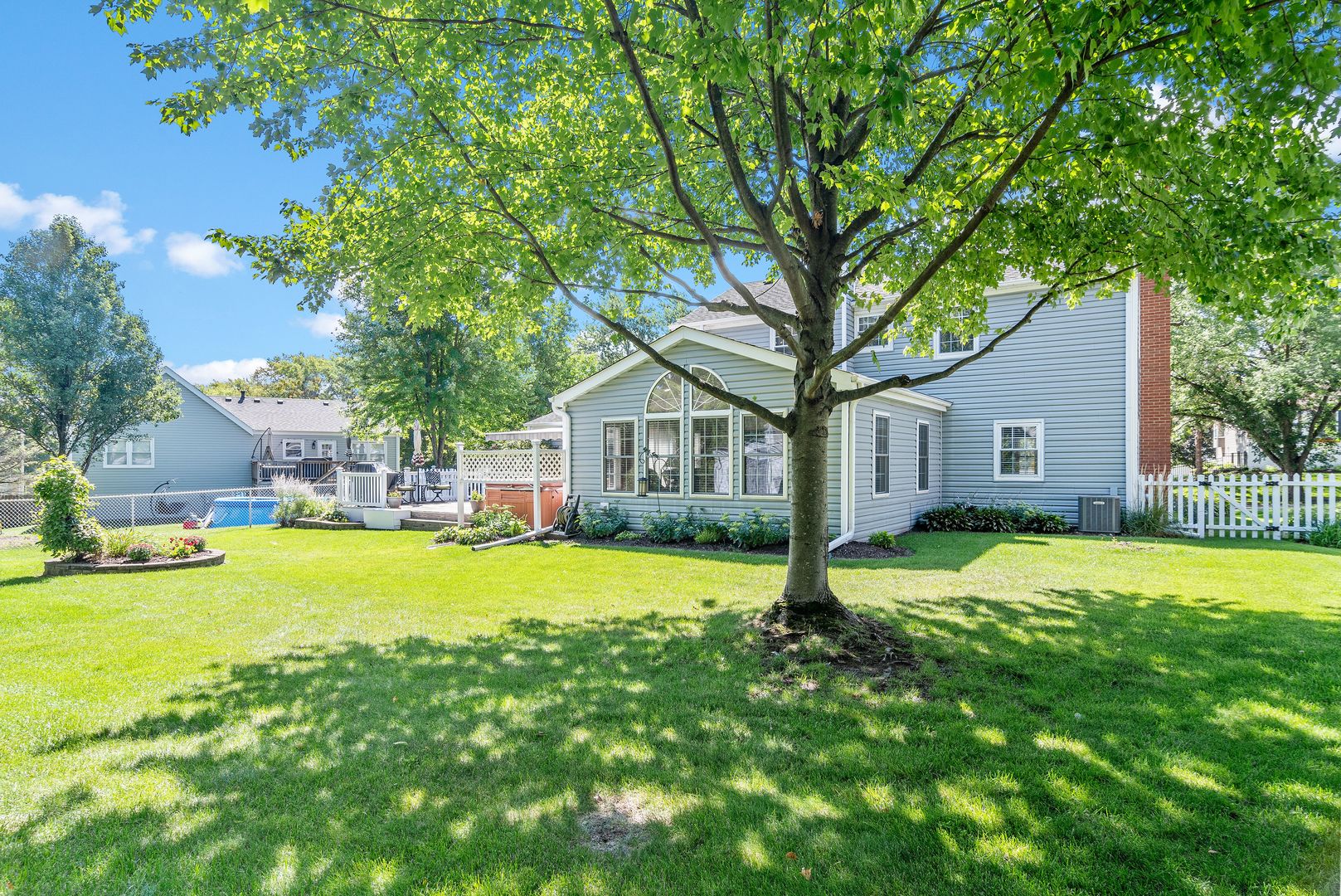 73 Foxcroft Road Naperville, IL 60565 - Photo 31 of 37 a house with a big yard and large trees