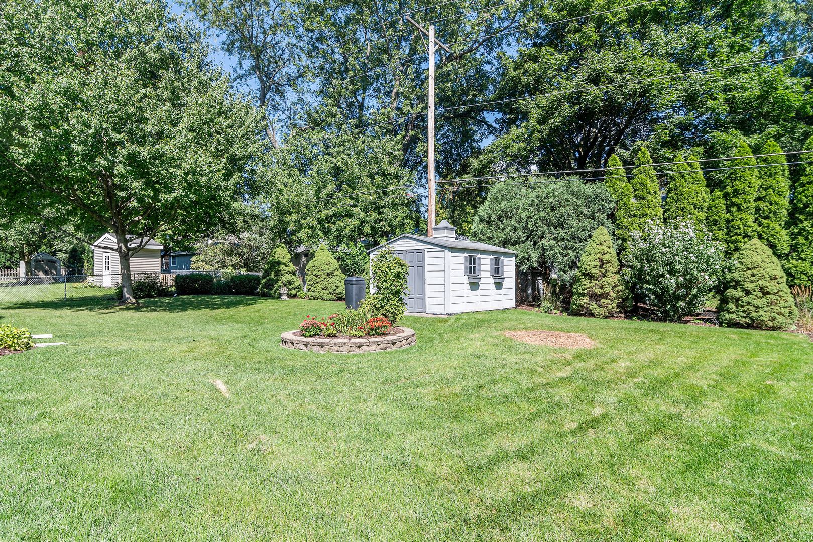 73 Foxcroft Road Naperville, IL 60565 - Photo 35 of 37 a big yard with lots of green space and plants