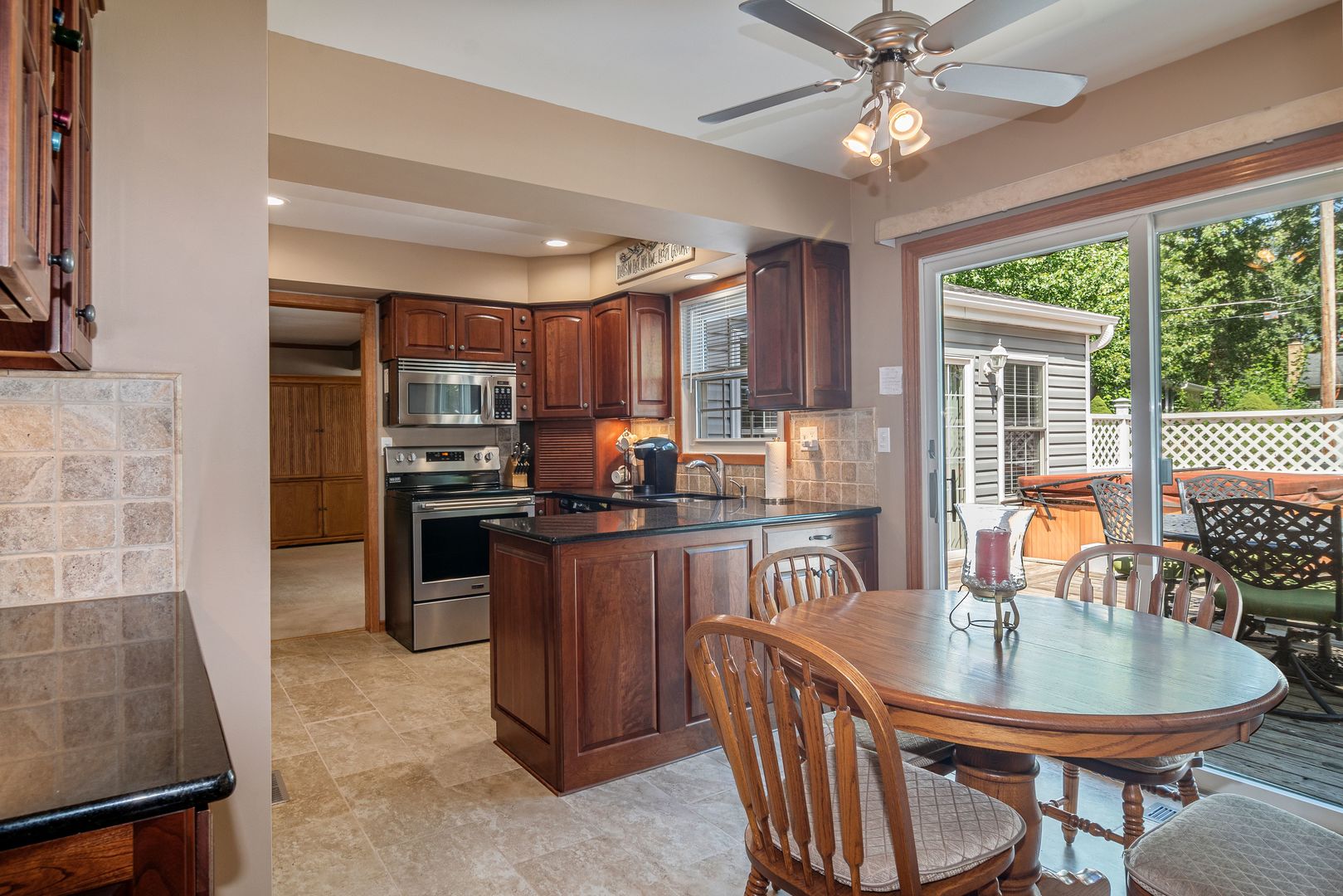 73 Foxcroft Road Naperville, IL 60565 - Photo 5 of 37 a kitchen with a table chairs microwave and refrigerator