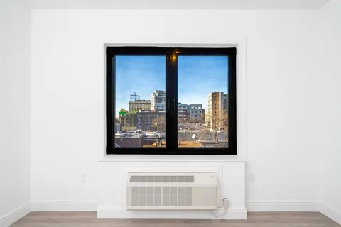 a bedroom with a bed and a table