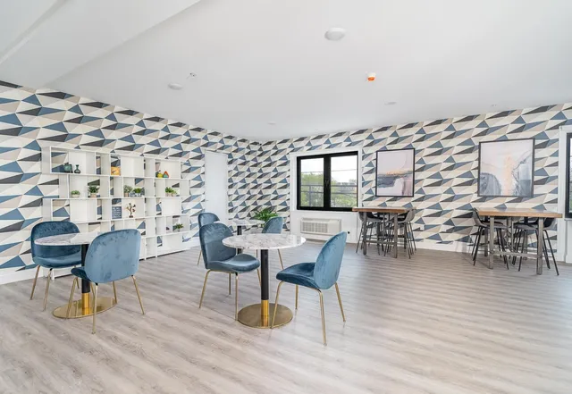 a view of a bedroom with a bookshelf