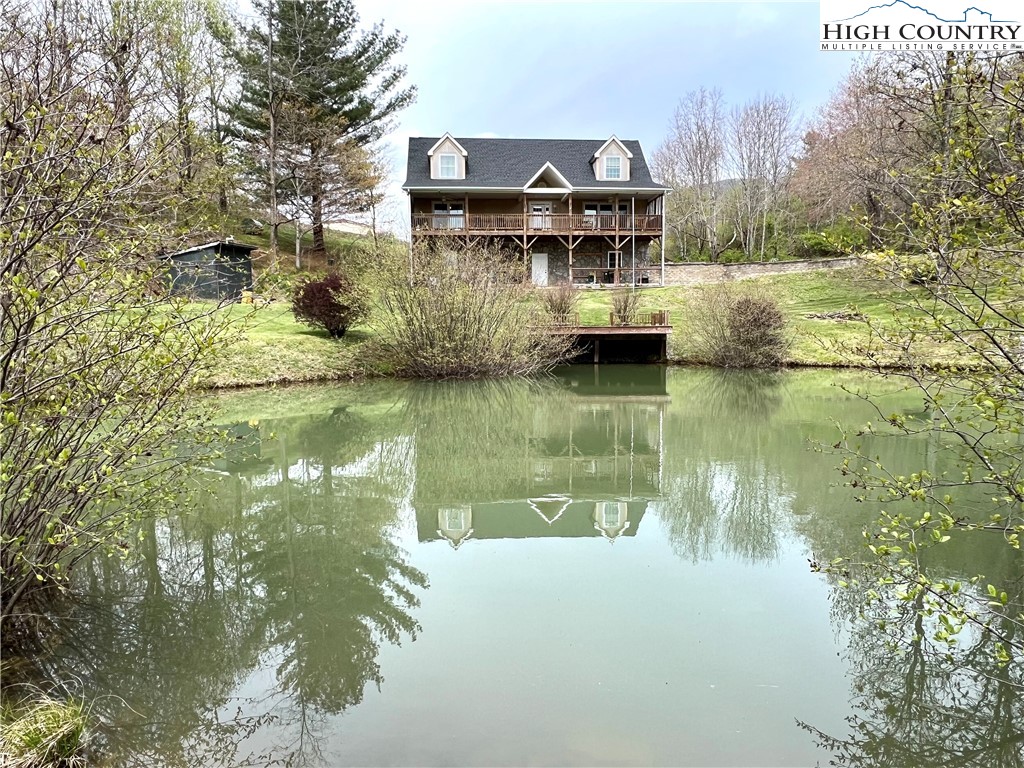 1534 Longhope Road Todd, NC 28684 - Photo 1 of 35 a view of a lake with houses