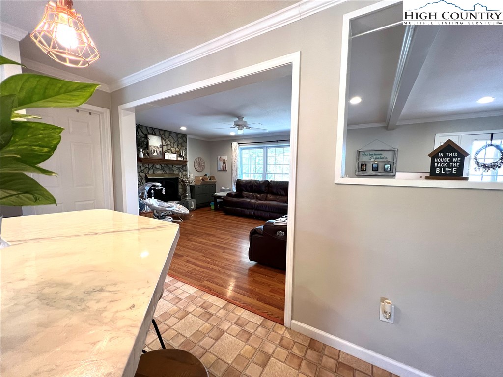 1534 Longhope Road Todd, NC 28684 - Photo 11 of 35 a view of a hallway with furniture and a kitchen view