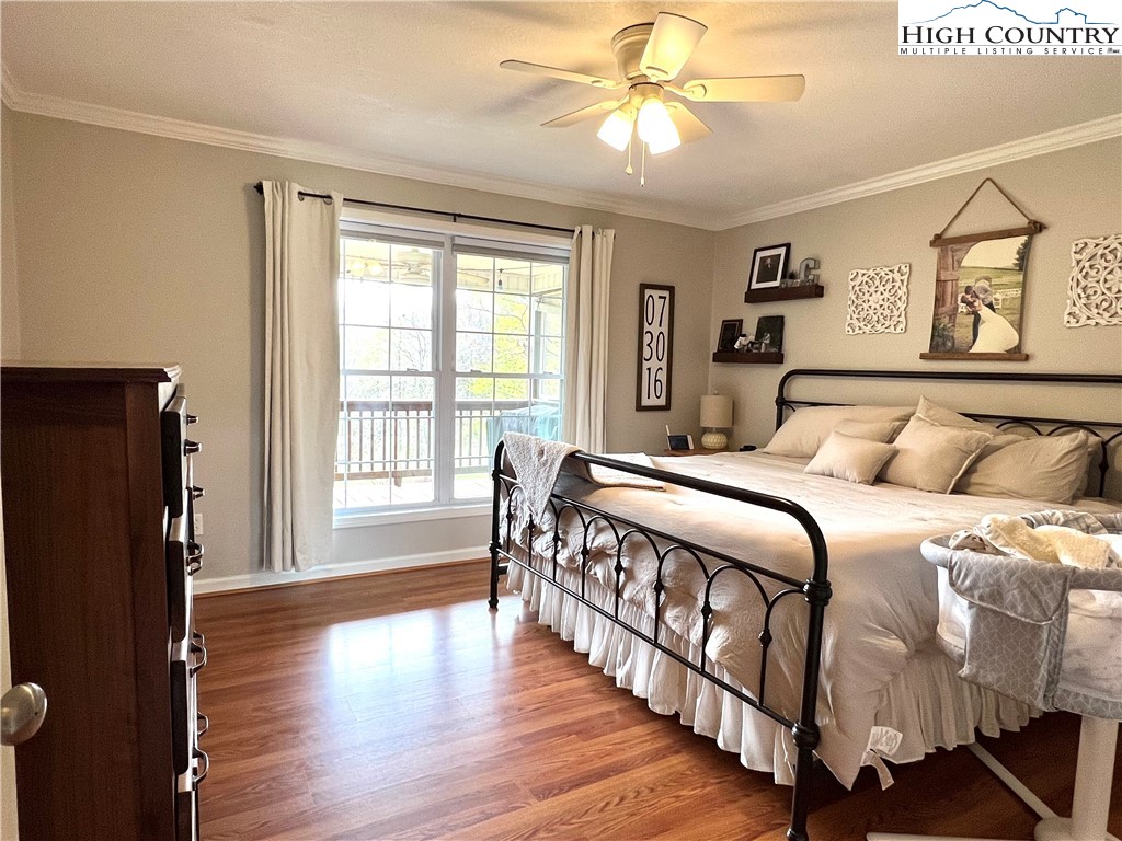 1534 Longhope Road Todd, NC 28684 - Photo 14 of 35 a bedroom with a large bed and a window