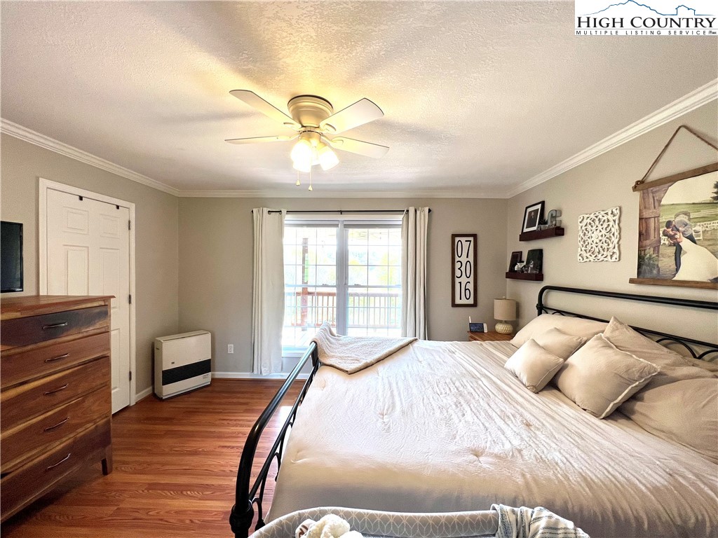 1534 Longhope Road Todd, NC 28684 - Photo 15 of 35 a bedroom with a bed and wooden floor