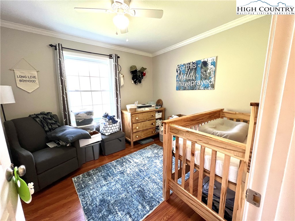 1534 Longhope Road Todd, NC 28684 - Photo 18 of 35 a bedroom with furniture and a window