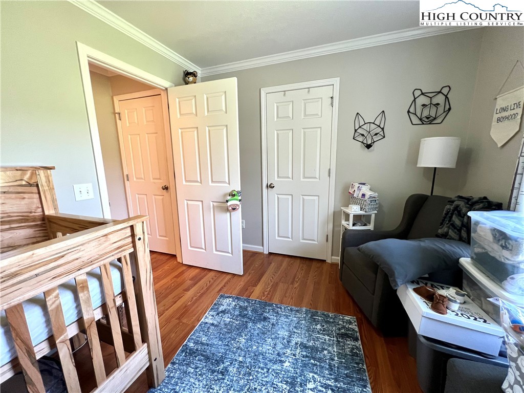 1534 Longhope Road Todd, NC 28684 - Photo 19 of 35 a living room with furniture and a wooden floor