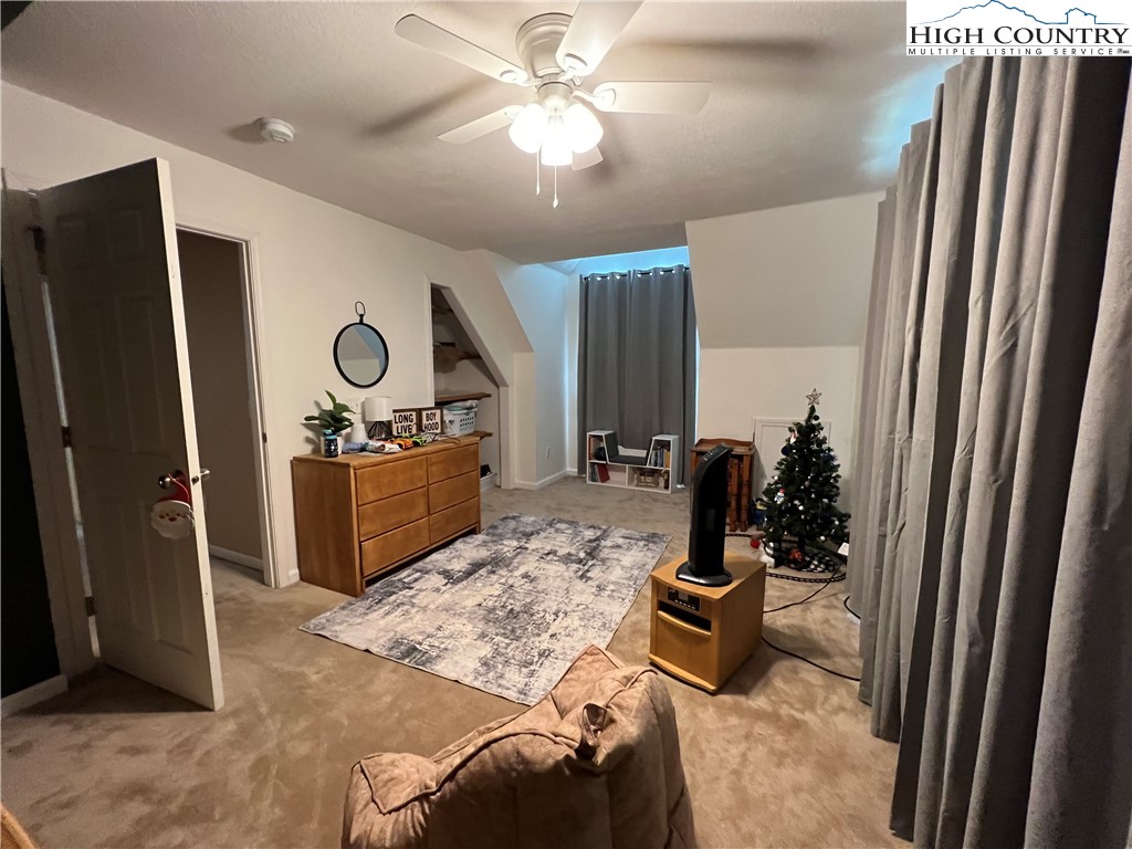 1534 Longhope Road Todd, NC 28684 - Photo 20 of 35 a living room with furniture and a flat screen tv