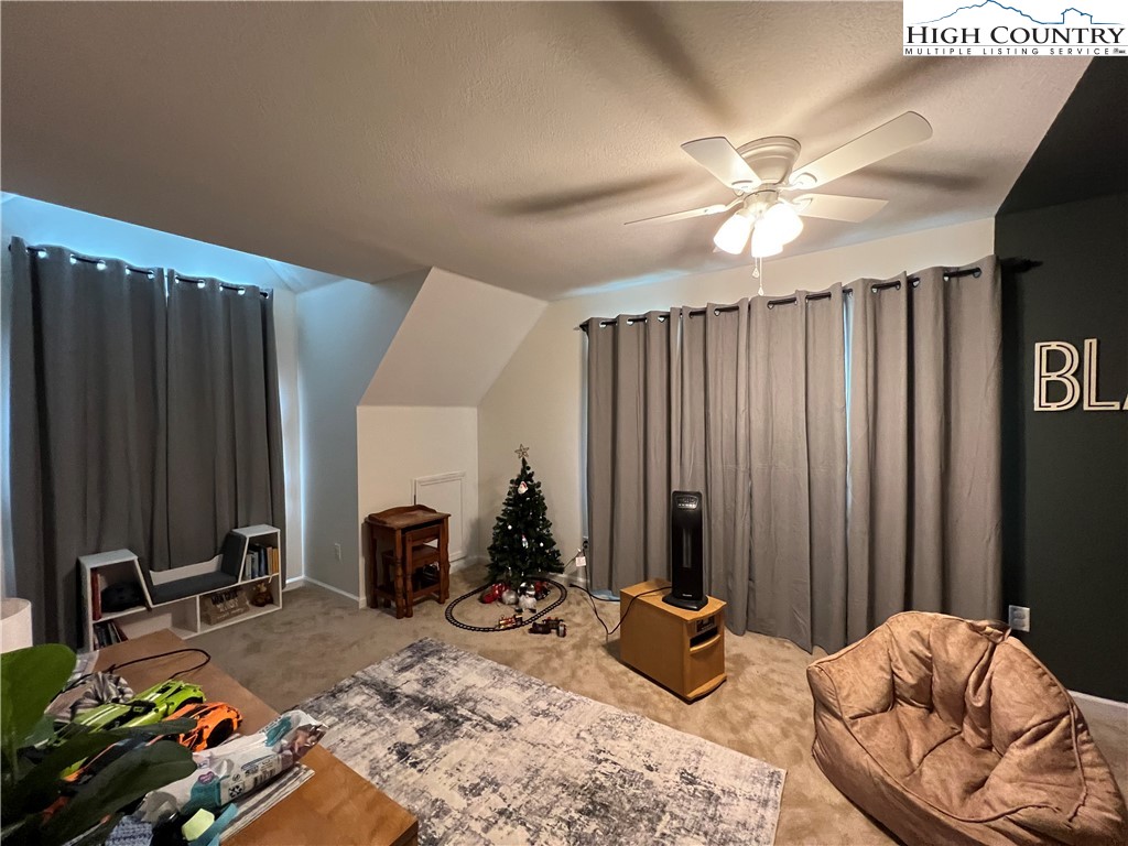 1534 Longhope Road Todd, NC 28684 - Photo 22 of 35 a bedroom with furniture and a large window