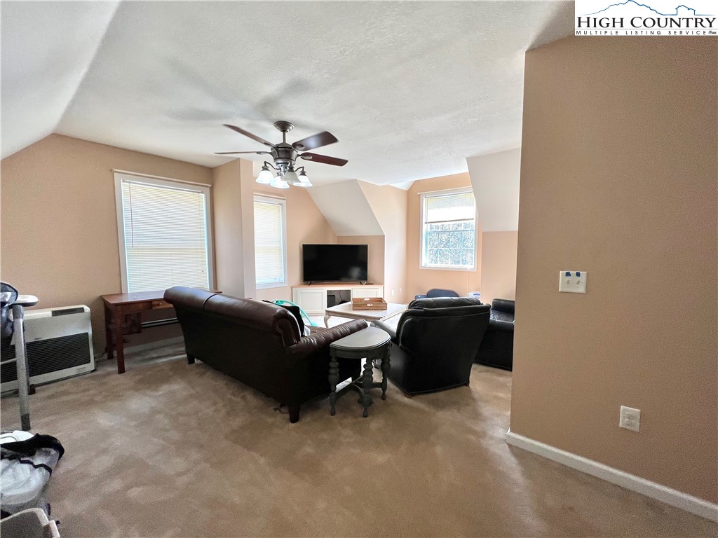 1534 Longhope Road Todd, NC 28684 - Photo 26 of 35 a living room with furniture and a flat screen tv