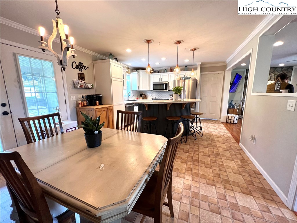 1534 Longhope Road Todd, NC 28684 - Photo 10 of 35 a dining room filled with stainless steel appliances kitchen island granite countertop furniture