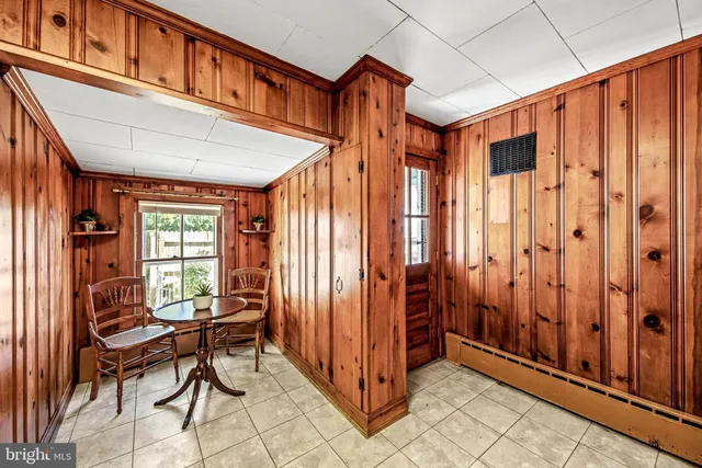 a view of a balcony with furniture and a window