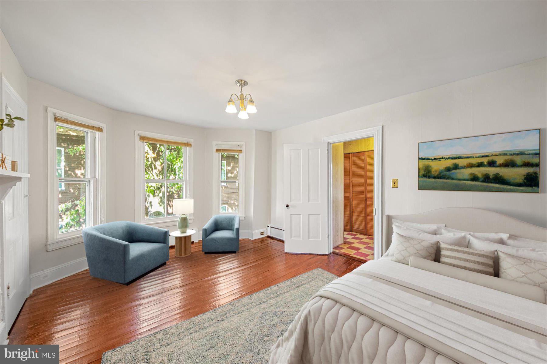 817 Locust Street Cambridge, MD 21613 - Photo 16 of 44 a bedroom with furniture and wooden floor