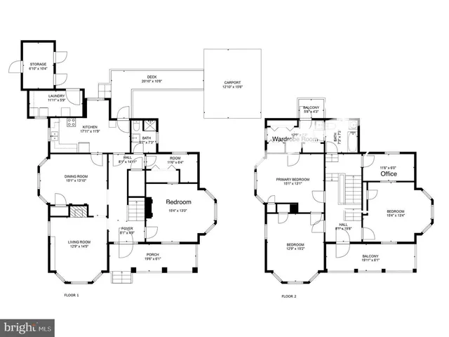 a view of a patio with couches and a fire pit and wooden fence