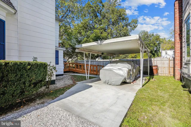 a view of a house with wooden deck