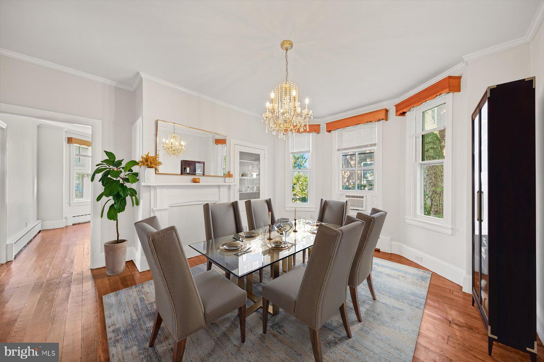 817 Locust Street Cambridge, MD 21613 - Photo 10 of 44 a view of a dining room with furniture window and wooden floor