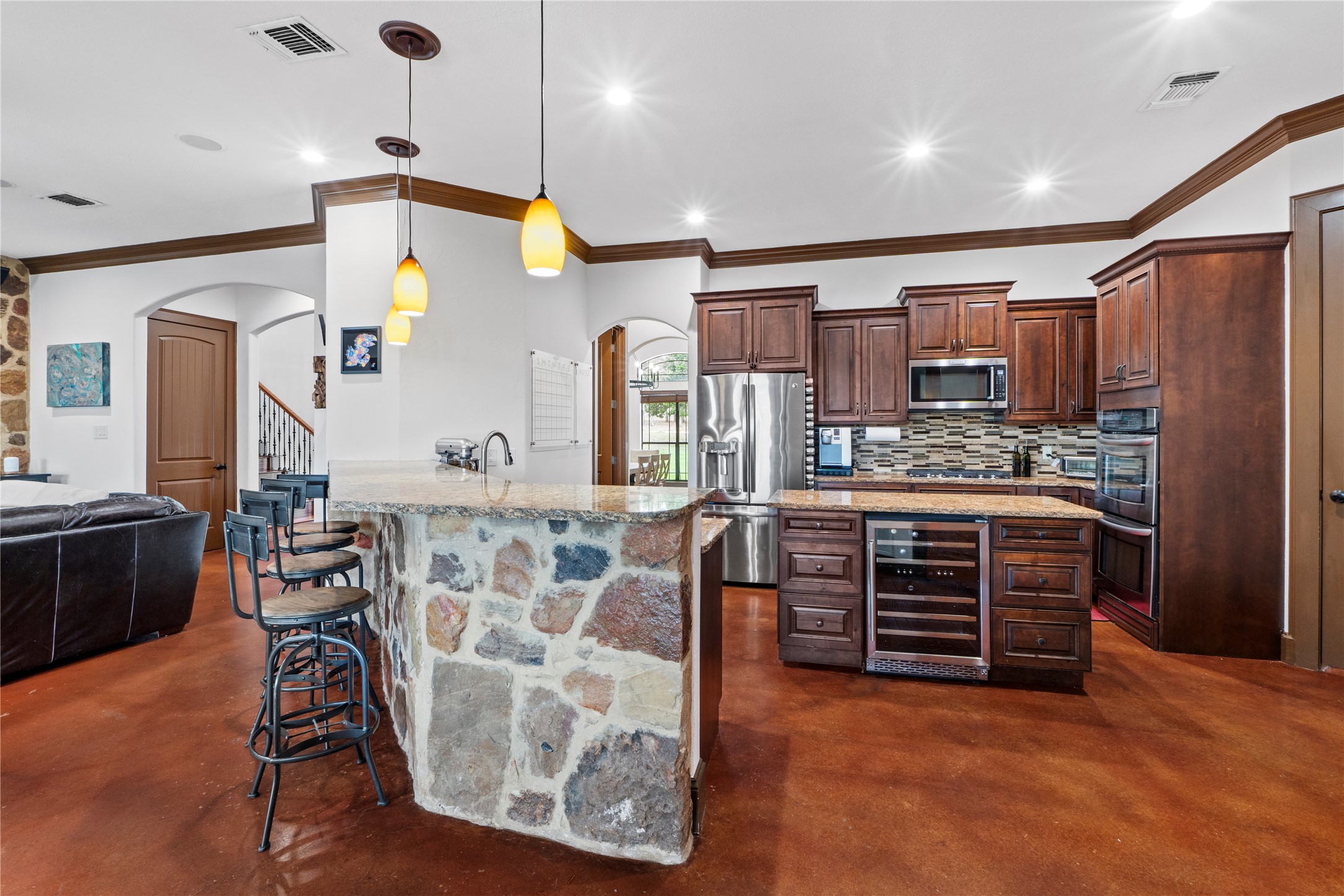8211 Moon Rise Trail Jonestown, TX 78645 - Photo 14 of 34 Kitchen features a center island and updated appliances.