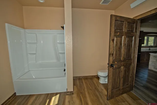 a bathroom with a granite countertop shower