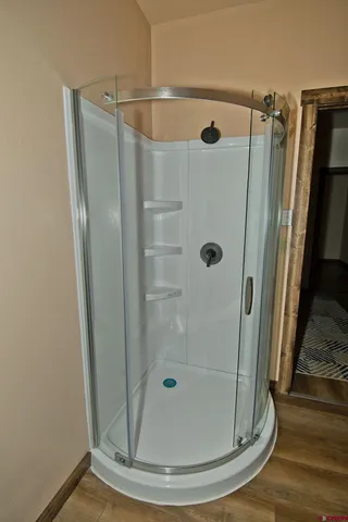 a bathroom with a glass shower door