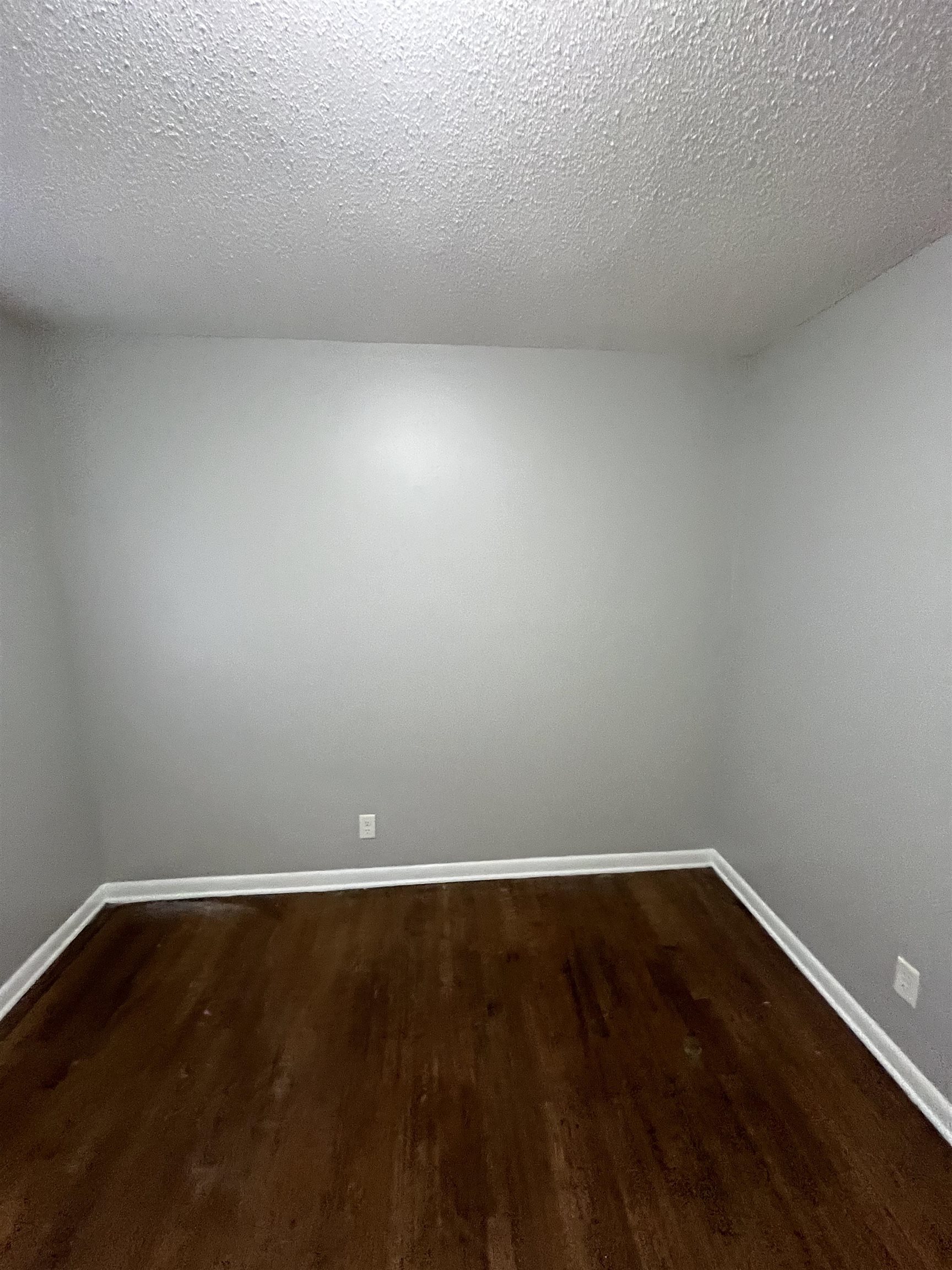 4173 Cottonwood Road Memphis, TN 38118 - Photo 2 of 13 a view of an empty room with wooden floor