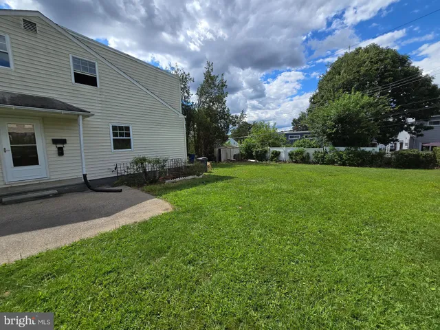 a view of a backyard of the house