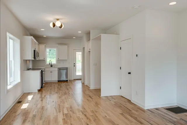 a view of kitchen with wooden floor