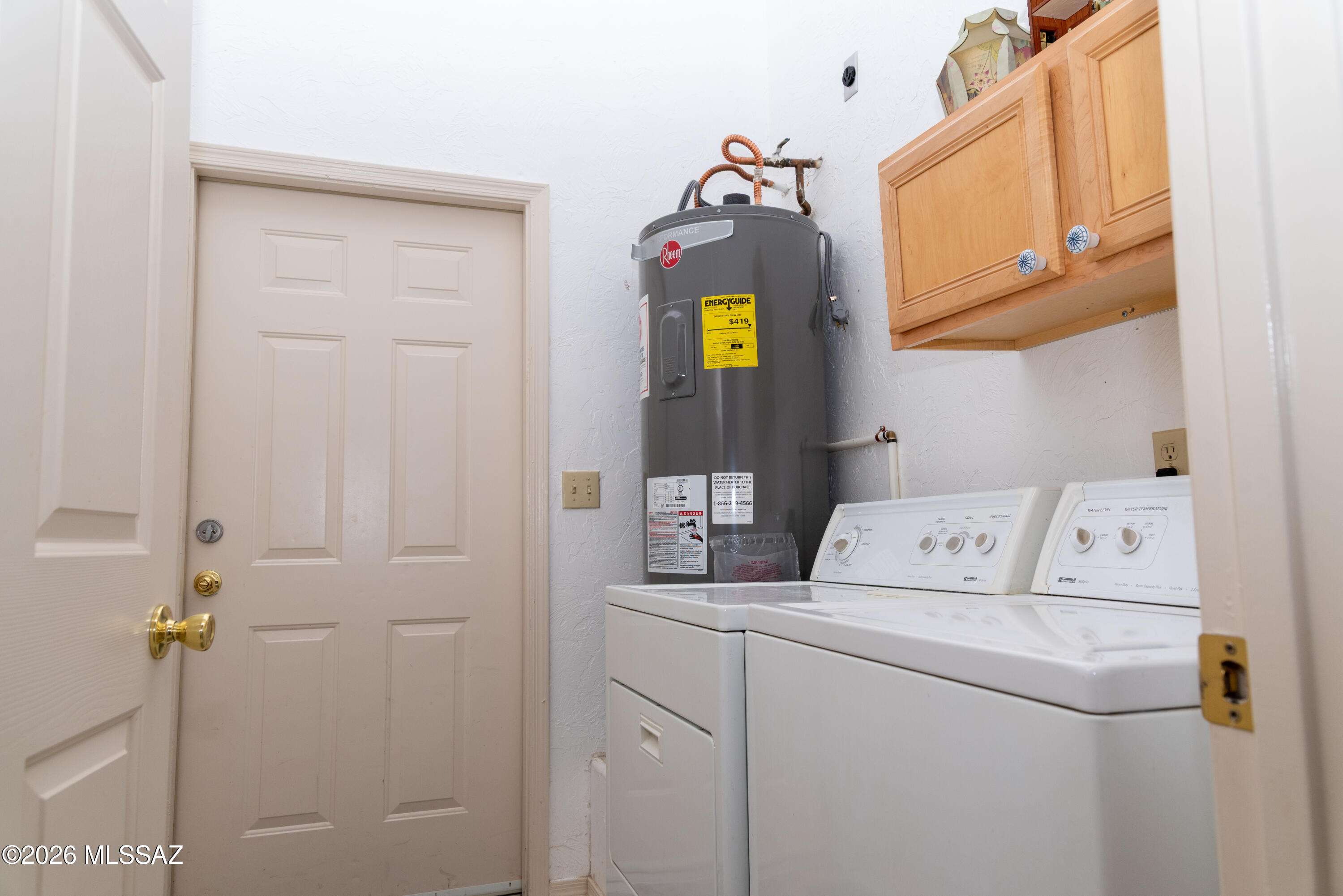 1242 Vista Court Rio Rico, AZ 85648 - Photo 6 of 16 a utility room with dryer and washer