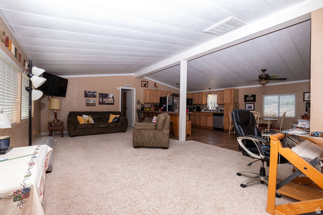 855 East 300 N Street Beaver, UT 84713 - Photo 36 of 44 Spacious interior featuring neutral carpeting, light-toned walls, and white ceiling panels