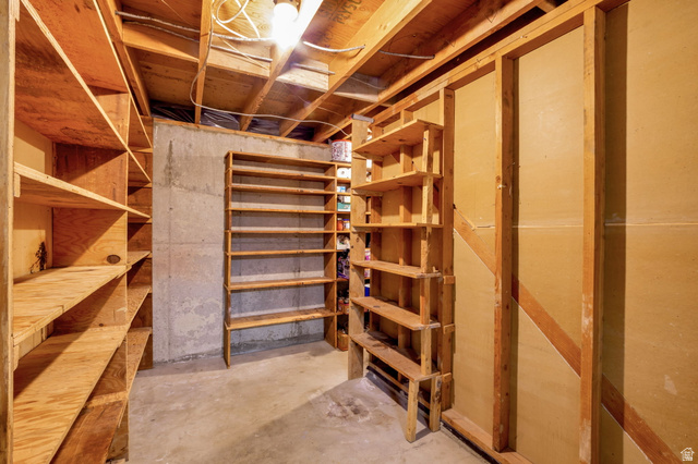 447 550 South Bountiful, UT 84010 - Photo 25 of 25 Utility space featuring exposed wood ceiling joists and unfinished concrete flooring