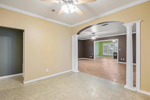 en view interior of a house with a empty space and chandelier fan