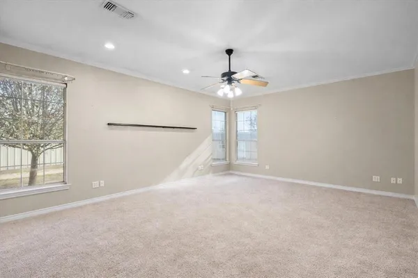 a view of an empty room with a window