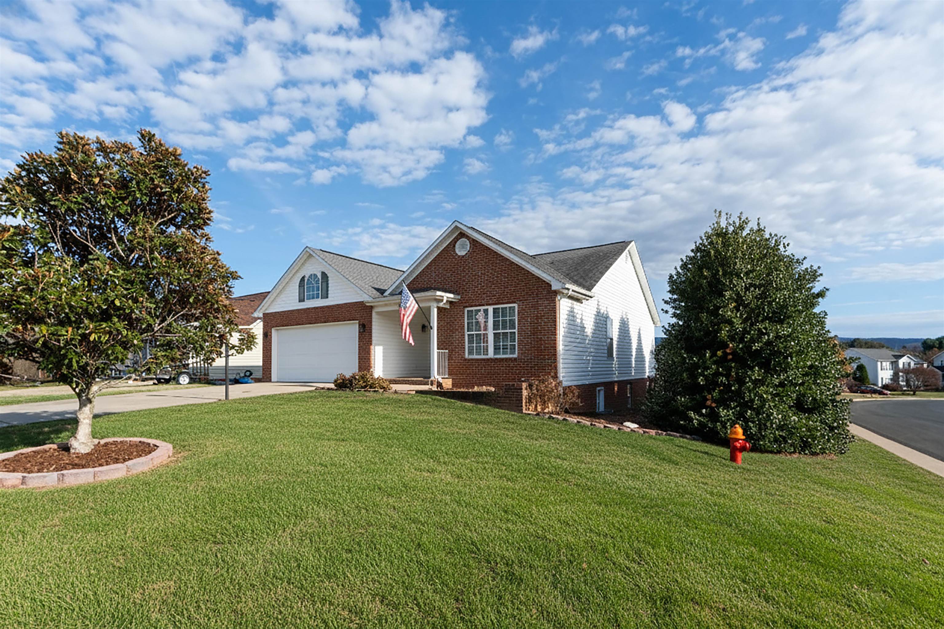 a house with huge green field in front of it